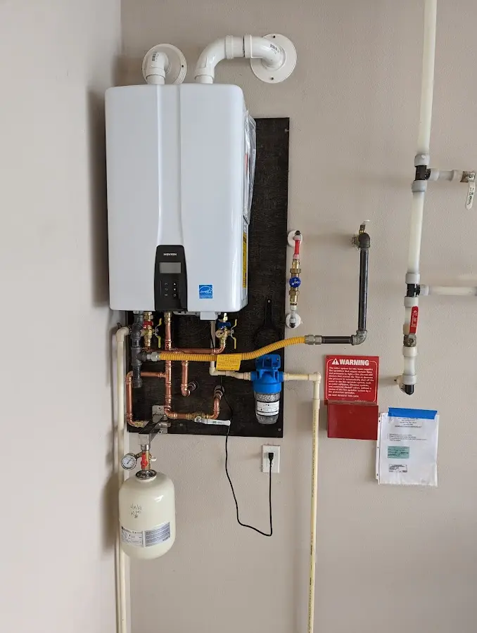 Professional plumber installing copper piping in a Cedar Park home